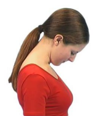Side profile of a woman with her neck flexed, head forwards and chin tucked.