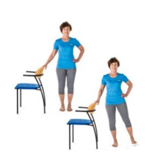 A woman stands next to a chair with one hand on the top of the chair and the other on her hip. A second image shows the same position, but the right leg has been lifted sideways away from her body. 